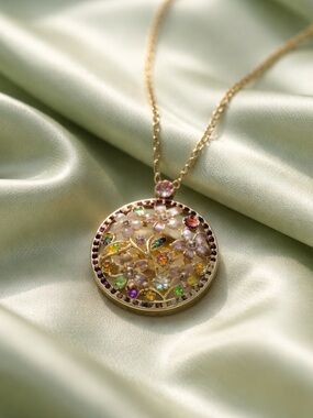 Enamel Flowers & Rhinestones In A Circular Pendant & Gold Tone Chain